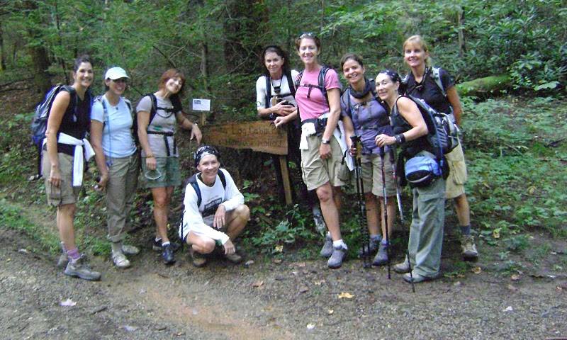 The eight Adventure Girls gathered together on a wooded section of the Appalachian Trail.