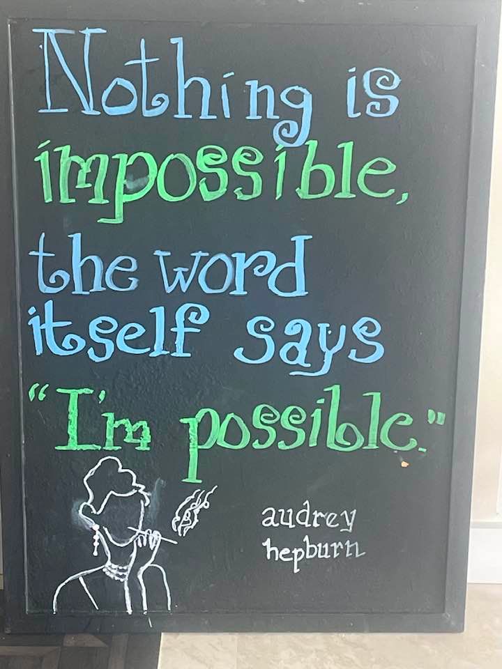 A colorful chalkboard featuring the Audrey Hepburn quote: Nothing is impossible, the word itself says I’m possible.